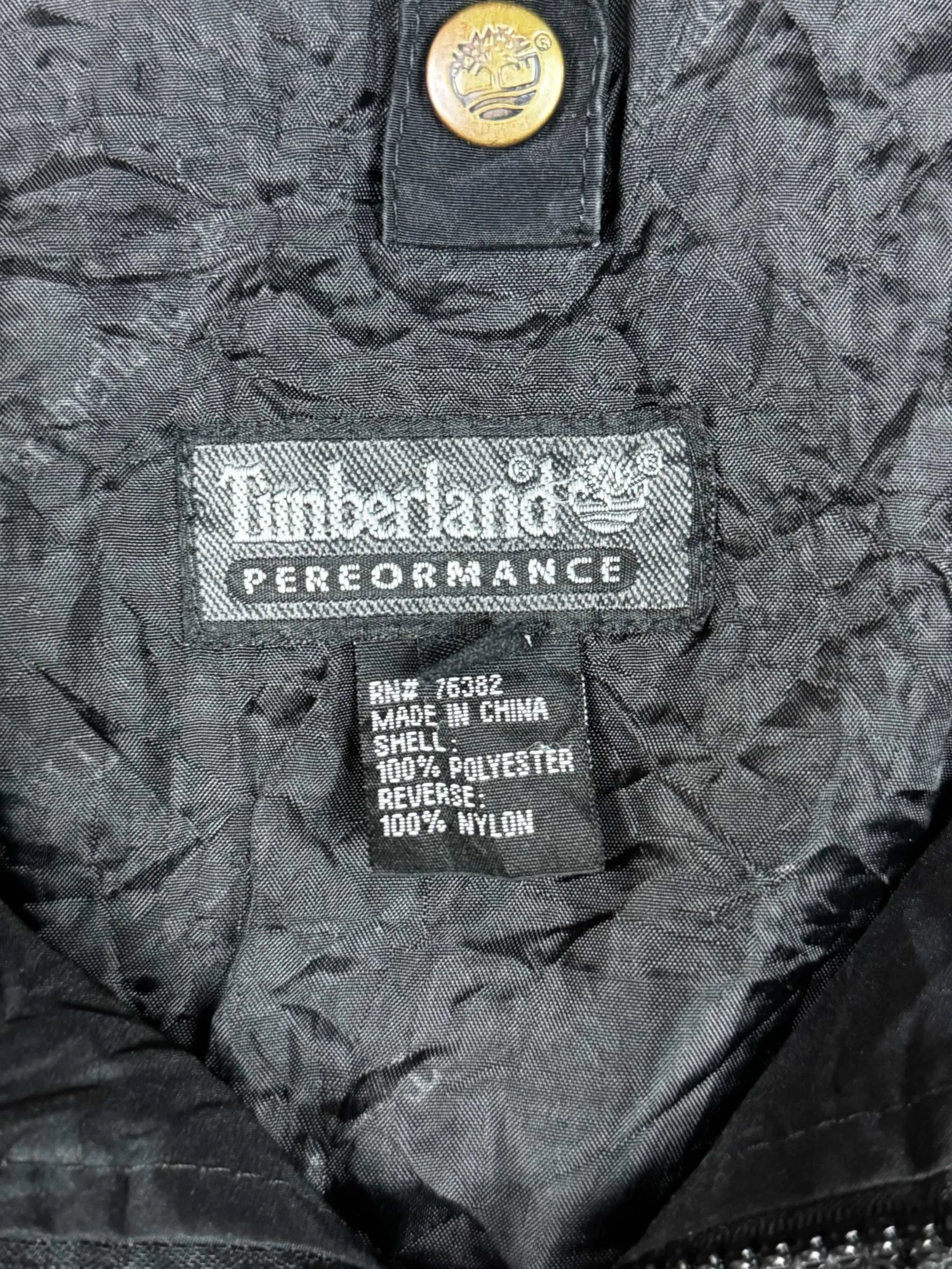 Timberland Fleecejacke mit Innenetikett, grau, Größe M, aus hochwertigem Fleece-Material.